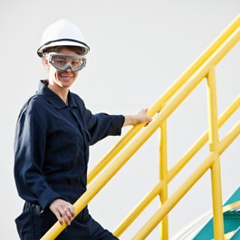 Female plant worker on stairs